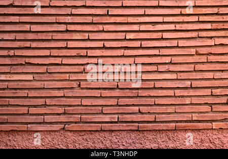 Stone Wall background from red building contruction facade. Stock Photo