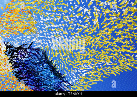 Abstract colorful background made from lot of diversity cloth against blue sky Stock Photo