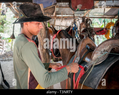 February 9, 2019 - Finca El ParaÃ-So/Yopal, Casanare, Colombia - Cow boy seen saddling a horse at the El ParaÃ-so finca.Colombian cowboys taking care of the cows in the region of Casanare, eastern Colombia, between the Ands, the Orinoco River and the border with Venezuela. These are Plains and pastures with wide rivers and marshes, a region of big biodiversity. But nowadays, it is in danger because of climate change. Credit: Jana Cavojska/SOPA Images/ZUMA Wire/Alamy Live News Stock Photo