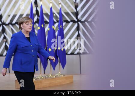 Brussels, Belgium. 10th Apr, 2019. German Chancellor Angela Merkel arrives at the European Union headquarters to attend the special meeting of the European Council in Brussels, Belgium, on April 10, 2019. Leaders of the European Union's remaining 27 member countries have agreed to an extension of Brexit, European Council President Donald Tusk said on Twitter Wednesday night. Credit: Zhang Cheng/Xinhua/Alamy Live News Stock Photo