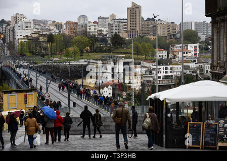 Porto, Portugal. 7th Apr, 2019. People are seen walking on D. Luis bridge. In 2018, Porto entered the list of the 100 most visited cities in the world in a ranking prepared by Euromonitor International. In 2018 it is estimated that the number of tourists reached 2.39 million. Credit: Omar Marques/SOPA Images/ZUMA Wire/Alamy Live News Stock Photo