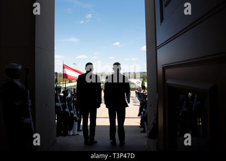 Arlington, United States Of America. 10th Apr, 2019. U.S. Acting Secretary of Defense Patrick Shanahan, right, stands for the national anthems during the arrival ceremony for Austrian Minister of Defense Mario Kunasek, left, at the Pentagon April 10, 2019 in Arlington, Virginia. Credit: Planetpix/Alamy Live News Stock Photo