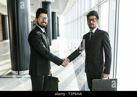 Two Indian business men shaking hands Stock Photo