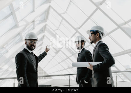 businessman and architects discussing the sketches of the new project Stock Photo