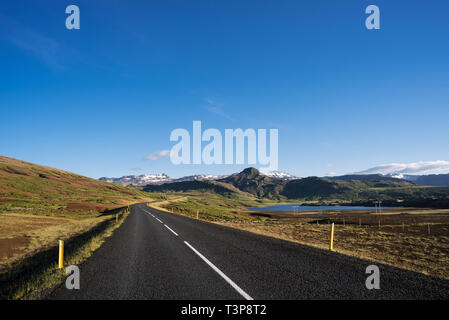 Road number 1 in Iceland. Clear blue sky. Sunny weather summer day. View of the mountains Stock Photo