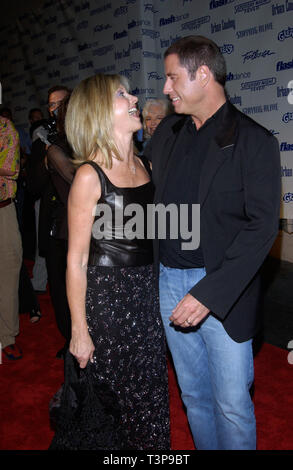LOS ANGELES, CA. September 24, 2002: Actor JOHN TRAVOLTA (Grease, Saturday Night Fever, Urban Cowboy) & actress OLIVIA NEWTON-JOHN (Grease) at Paramount Reunion party in Hollywood.  The party was held to celebrate the DVD release of Paramount musicals Saturday Night Fever, Grease, Flashdance, Footloose, Urban Cowboy, and Staying Alive. © Paul Smith / Featureflash Stock Photo