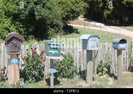 Four different post boxes in Golden Bay rural New Zealand Stock Photo