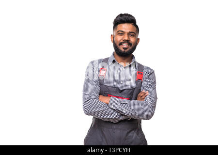 Portrait of cheerful repairer in shirt and overall having arms crossed looking at camera isolated on grey background Stock Photo
