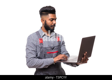 Handsome auto mechanic with laptop on white background Stock Photo