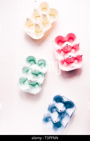 Colored eggs container, easter concept, hard natural direct light Stock Photo