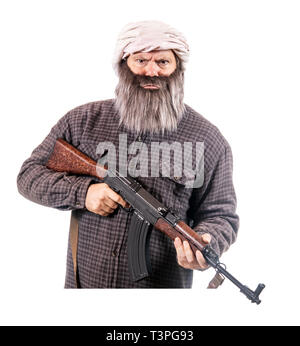 The bearded man armed with kalashnikov isolated on a white background. Muslim warrior with automatic weapon. Stock Photo