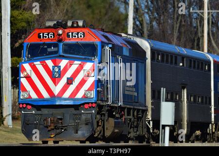 Geneva, Illinois, USA. A Metra locomotive leading a commuter train from Chicago through Geneva, Illinois.