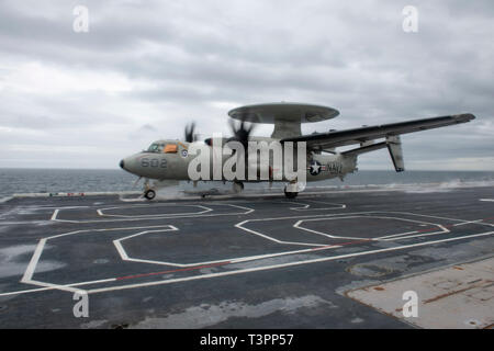 190409-N-QD512-0252  ATLANTIC OCEAN (April 9, 2019) An E-2CC Hawkeye early warning and attack aircraft, assigned to the 'Screwtops' of Airborne Early Warning Squadron (VAW) 123 takes off on the flight deck of the aircraft carrier USS Dwight D. Eisenhower (CVN 69). Ike is underway conducting flight deck certification during the basic phase of the Optimized Fleet Response Plan (OFRP). (U.S. Navy photo by Mass Communication Specialist 3rd Class Kaleb Sarten) Stock Photo