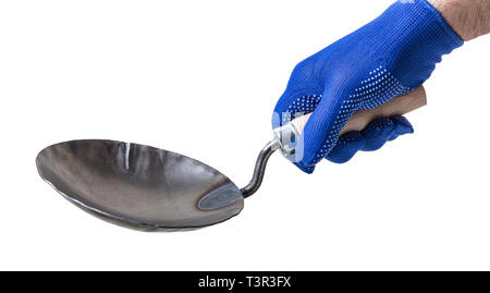 construction tool, trowel in male hand on white isolated background Stock Photo