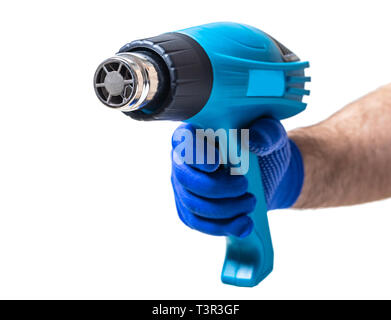 construction tool, hairdryer in male hand on white isolated background Stock Photo