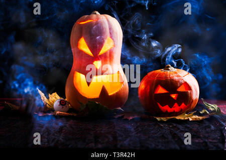 Image of two halloween pumpkins on black background Stock Photo