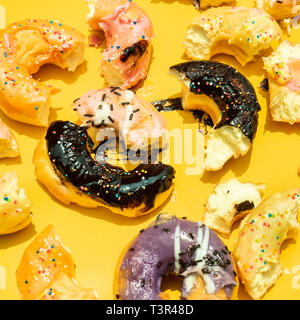 Top view of dirty donut on color pastel background.Eating and Healthy concepts Stock Photo