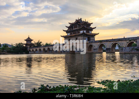 Oriental style stone bridge on a river in China Stock Photo