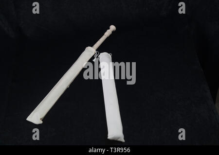 Standing on a black background, a white-colored instrument instruments flute wind intsrument Stock Photo
