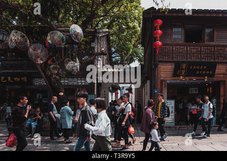 Sanfang Qixiang (Three Lanes and Seven Alleys), Fuzhou, China - 05 April 2019: People visiting the famous travel destination and walking on the Street Stock Photo