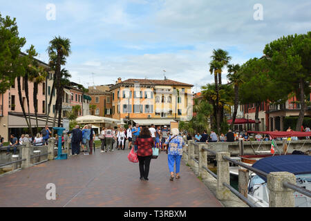 Tourists in the historical center of Sirmione on Lake Garda - Italy. Stock Photo