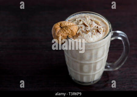 Anjeer milk shake or dried fig milk shake with almonds - selective focus Stock Photo