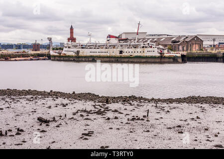 A view across the River Tees to Middlehaven from Port Clarence showing an old ship and the clock tower Stock Photo