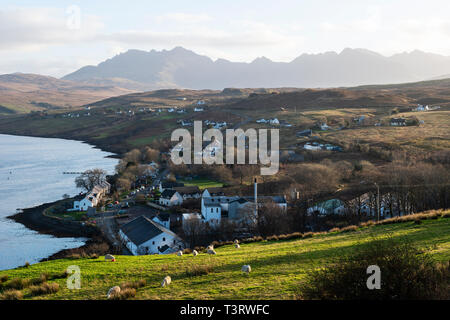 View looking over Carbost on Loch Harport to distant Cuillin Hills, Isle of Skye, Highland Region, Scotland, UK Stock Photo