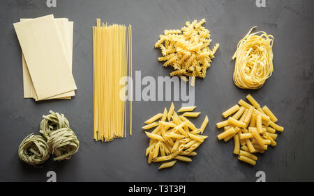 Different types of pasta from durum wheat varieties for cooking Mediterranean dishes. Stock Photo