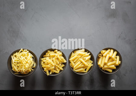 Different types of pasta from durum wheat varieties for cooking Mediterranean dishes. Stock Photo
