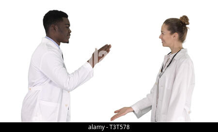 Successful team of surgeons giving high five and laughing isolated on white background on white background. Stock Photo