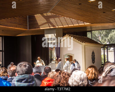 FATIMA, PORTUGAL - 6 APRIL, 2019:   Catholic Priest celebrating Mass at the Sanctuary of Fatima in Portugal Stock Photo