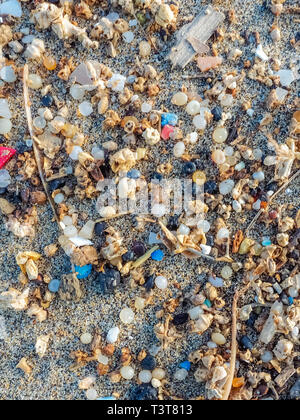 Microplastics found on the shore of a beach in Lanzarote. Sea pollution by plastic. vertical. canary island Stock Photo