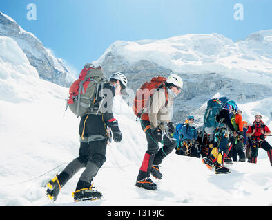 Hikers backpacking on mountain, Everest, Khumbu region, Nepal Stock Photo