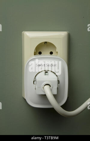 WI FI smart socket with a household electrical appliance included in it Stock Photo