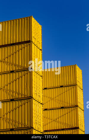 Shipping containers are stacked and used to support the facade of the ...