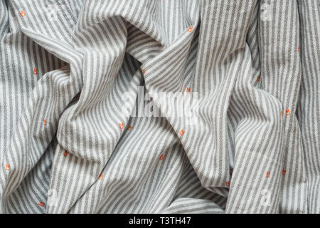 Striped Cotton Shirt Background. Crumpled Fabric Texture as Blank Background Stock Photo
