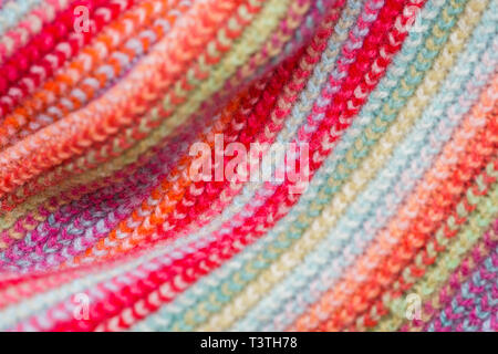 Multicolored Knitwear Sweater Fabric Texture. Bright saturated background Stock Photo