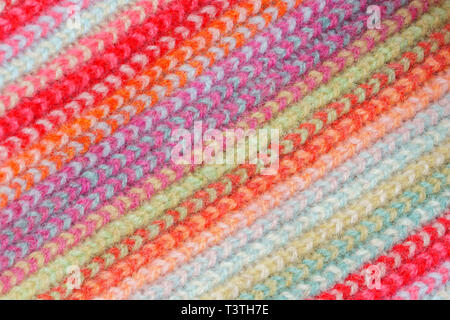 Multicolored Knitwear Sweater Fabric Texture. Bright saturated background Stock Photo