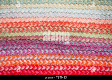 Multicolored Knitwear Sweater Fabric Texture. Bright saturated background Stock Photo