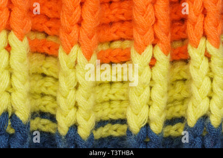 Multicolored Knitwear Sweater Fabric Texture. Bright saturated background Stock Photo