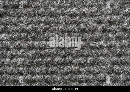 Texture of the Gray Nylon Carpet. Textile Background with Copy Space Stock Photo