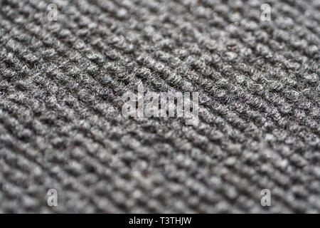 Texture of the Gray Nylon Carpet. Textile Background with Copy Space Stock Photo