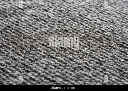 Texture of the Gray Nylon Carpet. Textile Background with Copy Space Stock Photo