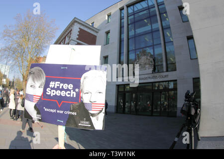 Placard saying, Free Speech, of Julian Assange seen outside Westminster Magistrates Court after Julian Assange was removed from the Ecuadorian Embassy after his asylum was terminated. Stock Photo