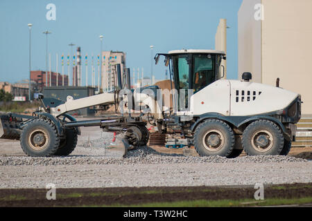 SAINT PETERSBURG, RUSSIA - AUGUST 31, 2017 A white tractor is building a road Stock Photo