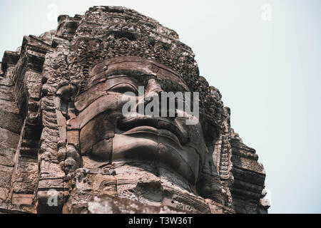 ANGKOR, CAMBOGIA - 15 MARCH 2018: The Bayon is a well-known and richly decorated Khmer temple at Angkor in Cambodia. Stock Photo