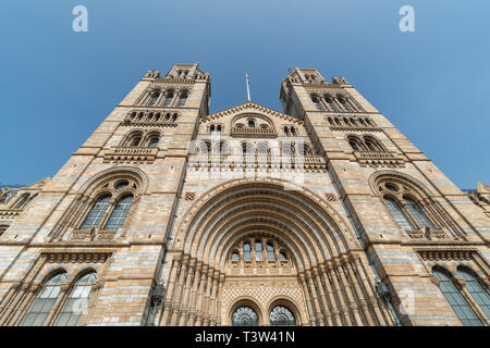 A wide view of the front of the Natural History Museum in London on a bright day Stock Photo