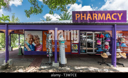 Cairns, Australia - February 18, 2019: Storefront of the pharmacy downtown Kuranda village shows purple and red colors, merchandise display and advert Stock Photo