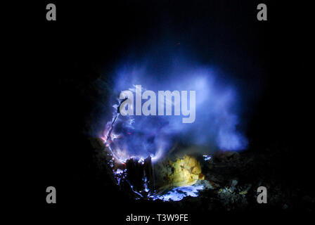 Blue fire from burning sulphur on Ijen Volcano, Java, Indonesia Stock Photo